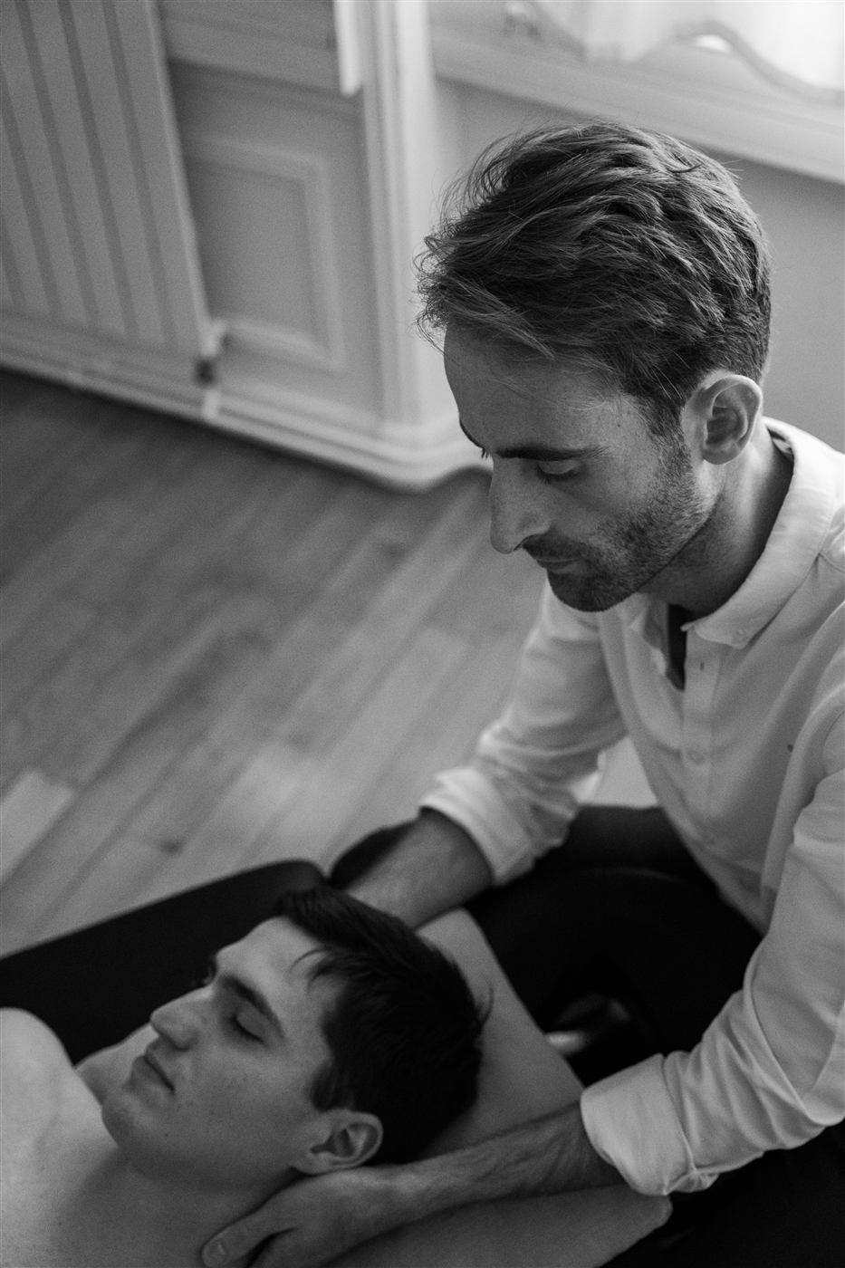 Pierre Barillec performing manual treatment on a patient at the clinic